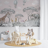 Safari animal wallpaper featuring giraffes and balloons in a playroom setting
