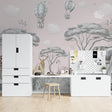 Safari nursery wallpaper with elephants and hot air balloons creating a dreamy atmosphere in a modern nursery