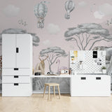 Safari nursery wallpaper with elephants and hot air balloons creating a dreamy atmosphere in a modern nursery