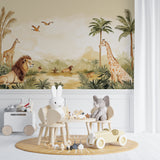African safari wallpaper in kids bedroom featuring lions and giraffes under palm trees