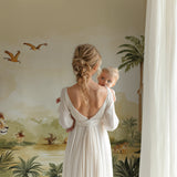 Jungle animals wallpaper creating focal point in nursery with safari theme