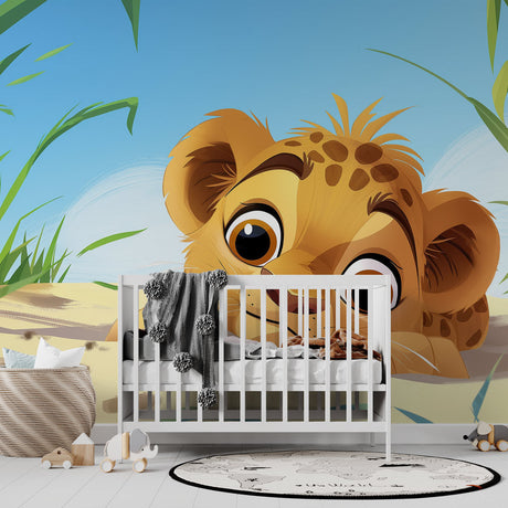 Safari animal wallpaper with baby lion cub shown in a bright nursery with natural wood furniture and soft textiles