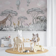 Safari nursery wallpaper in a cozy pink nursery with white furniture and soft textiles