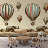 Safari Hot Air Balloon Wallpaper creating a dreamy atmosphere in a bright nursery with natural wooden furniture