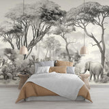 Safari elephant wallpaper mural styled in modern minimalist living room with gray sofa and natural light