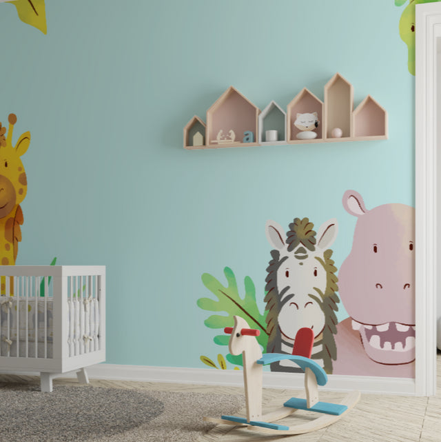 Safari nursery wallpaper bringing warmth to a modern nursery with soft mint walls and natural wood furniture