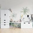 Safari animals wallpaper mural styled in a bright nursery with soft green accents and natural wood furniture