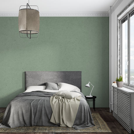 Sage green textured wallpaper in modern living room with natural light highlighting the subtle pattern