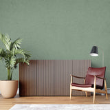 Green textured wallpaper in home office showing subtle depth variations