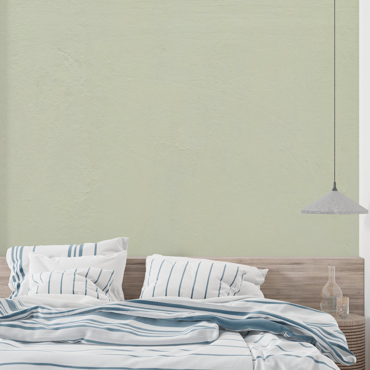 Dining room showcasing sage green wall design in natural daylight
