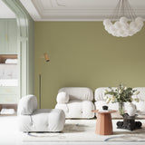 Sage green minimalist wallpaper in modern living room creating serene atmosphere