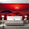 African sunset mural wallpaper creating warm ambiance in modern living room with acacia trees silhouettes at dusk
