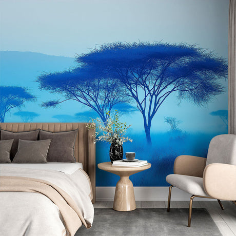 Blue African savanna wallpaper creates a serene atmosphere in a modern living room with minimal furniture