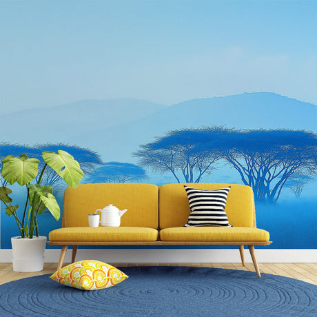 African savanna wallpaper creating a peaceful atmosphere in a modern living room with blue misty tree silhouettes
