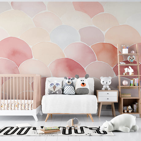 Pink scallop pattern wallpaper in a bright nursery with white furniture and soft textiles