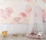 Pastel pink scallop pattern adding movement to a modern living room wall