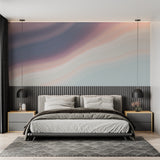Watercolor sky mural brightening a minimal dining space