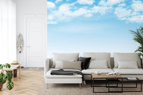 Sky mural wallpaper creating an airy atmosphere in a modern living room with natural light