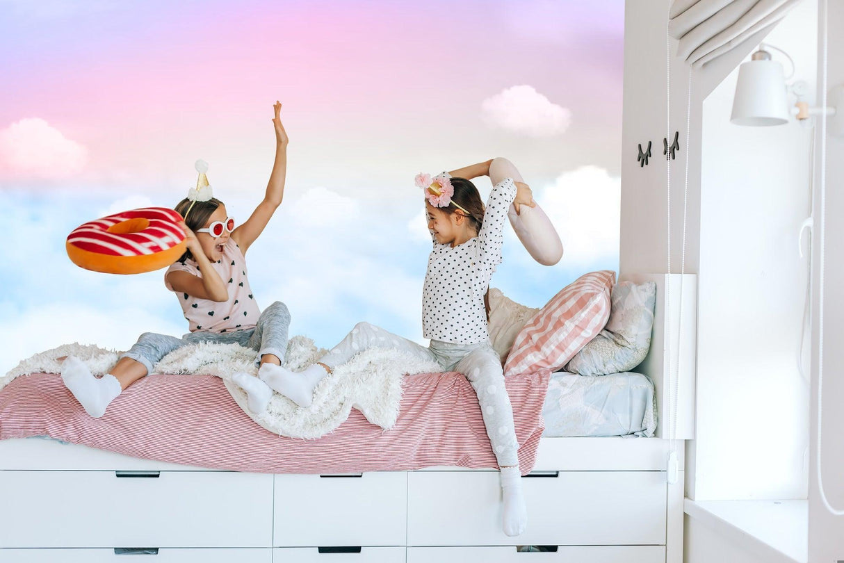 Dreamy sky wallpaper with soft pink clouds bringing serenity to a minimal bedroom setup
