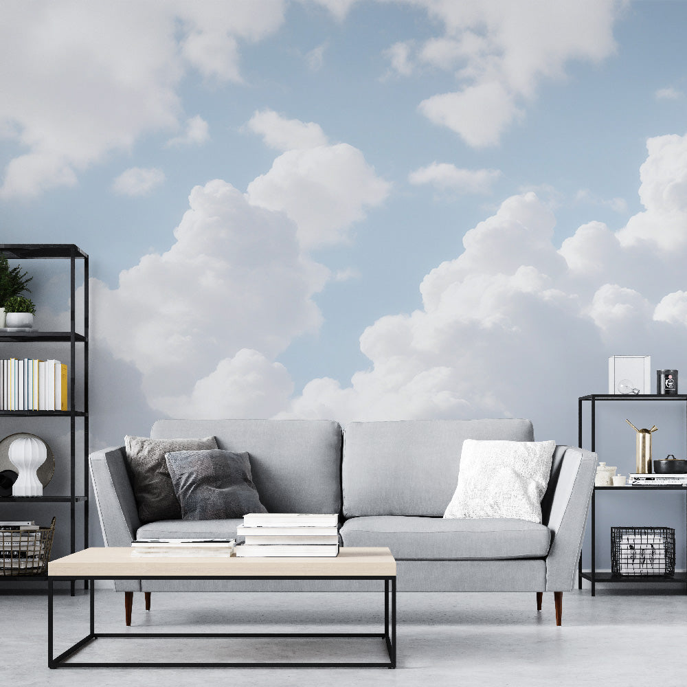 Cloud wall mural creates an airy atmosphere in a modern living room with natural light streaming through windows