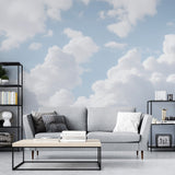 Cloud wall mural creates an airy atmosphere in a modern living room with natural light streaming through windows