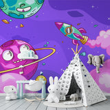 Reading nook with fun galaxy wallpaper creating a cozy space theme