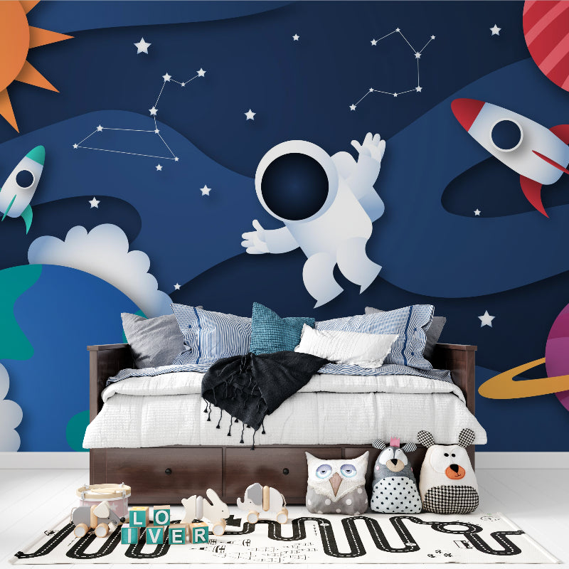 Astronaut wall mural showcasing night lighting effects in a nursery setting