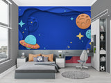 Space themed wall mural transforming a study area with deep blue galaxy design