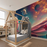 Space Mural Wallpaper bringing cosmic adventure to a modern kids bedroom with blue and orange accents