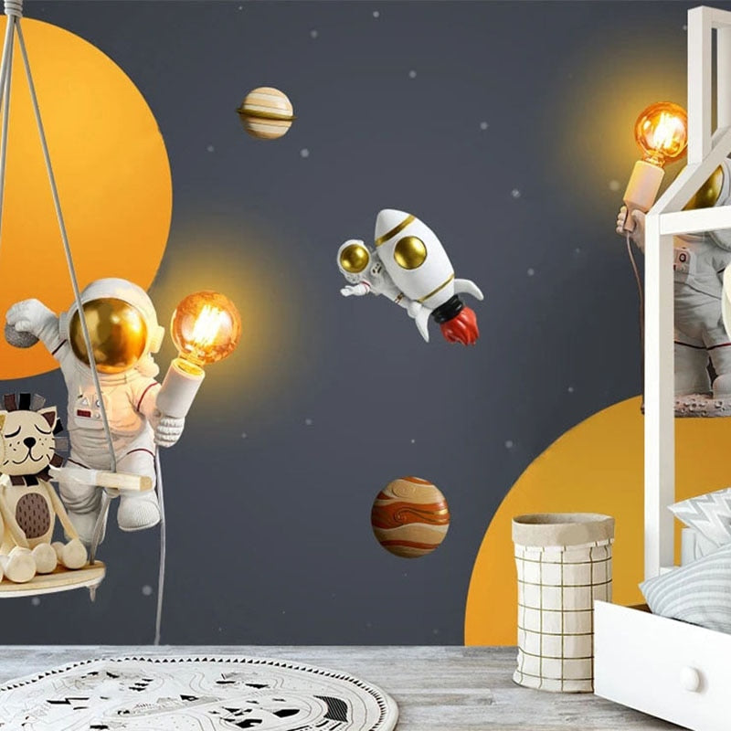 Astronaut wall mural bringing cosmic wonder to playful nursery space