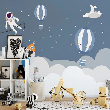Space themed wallpaper with astronaut and hot air balloons creating magic in a modern nursery with soft lighting