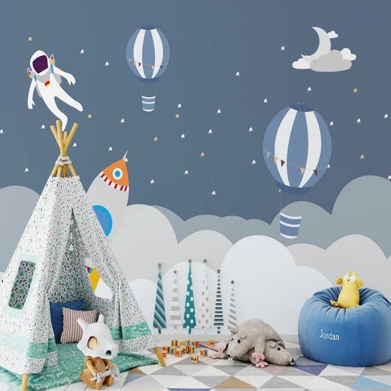 Kids bedroom showcase of space wallpaper with floating astronaut and dreamy hot air balloons