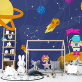 Nursery wall decorated with gentle space themed mural showing friendly astronaut