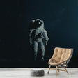 Space themed wallpaper with floating astronaut shown in modern bedroom, creating a dreamy atmosphere with starlit background
