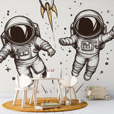 Modern Astronaut Line Art Wallpaper creating a striking focal point in a minimalist home office space