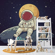 Space Mural Wallpaper featuring astronaut on moon surface, shown in modern children's bedroom with blue accent lighting