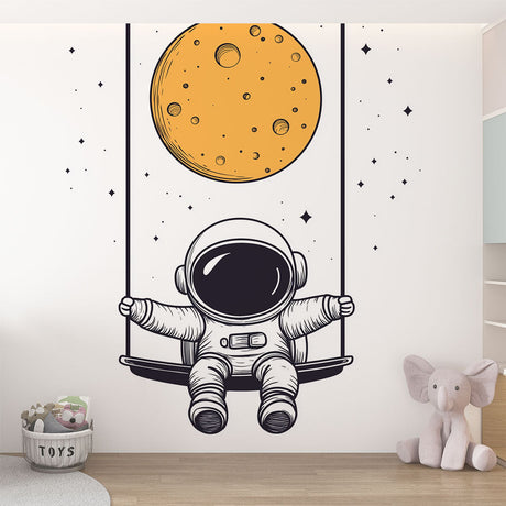 Space themed wallpaper with swinging astronaut shown in a modern nursery with white furniture and soft lighting