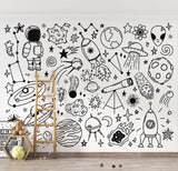 Study room featuring space themed wallpaper with educational doodles