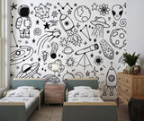 Nursery with monochrome space wallpaper showing planets and rockets