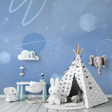 Space wall mural creating dreamy atmosphere in reading nook with celestial design