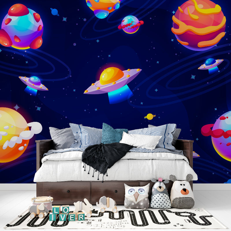 Playroom transformed with space themed wallpaper featuring colorful galaxy and floating spaceships