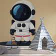 Space explorer wallpaper brings charm to a modern kids bedroom, featuring a friendly astronaut character