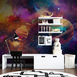 Galaxy mural wallpaper brightening playroom wall with colorful cosmic design