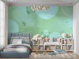Mint green space wallpaper in a modern nursery with white furniture, creating a peaceful sleeping environment