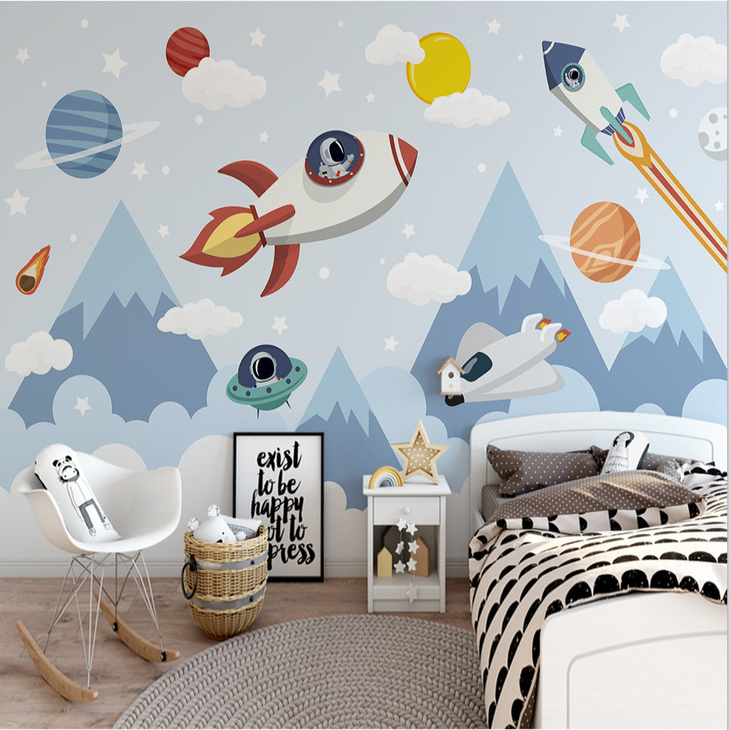Space mural wallpaper in modern nursery with rockets and planets creating a dreamy atmosphere