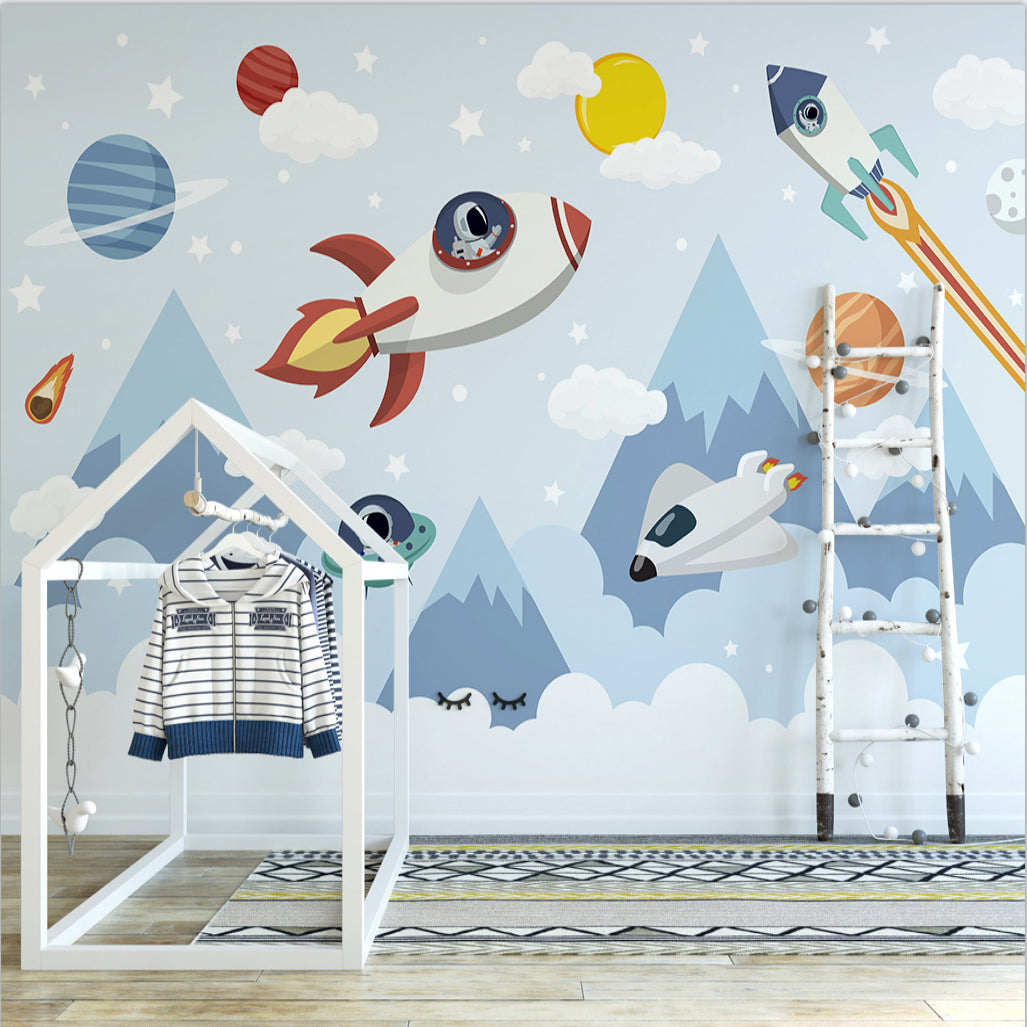 Kids study area with mountain and space wallpaper showing planets and stars