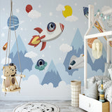 Reading nook with space adventure wallpaper featuring mountains and floating spaceships