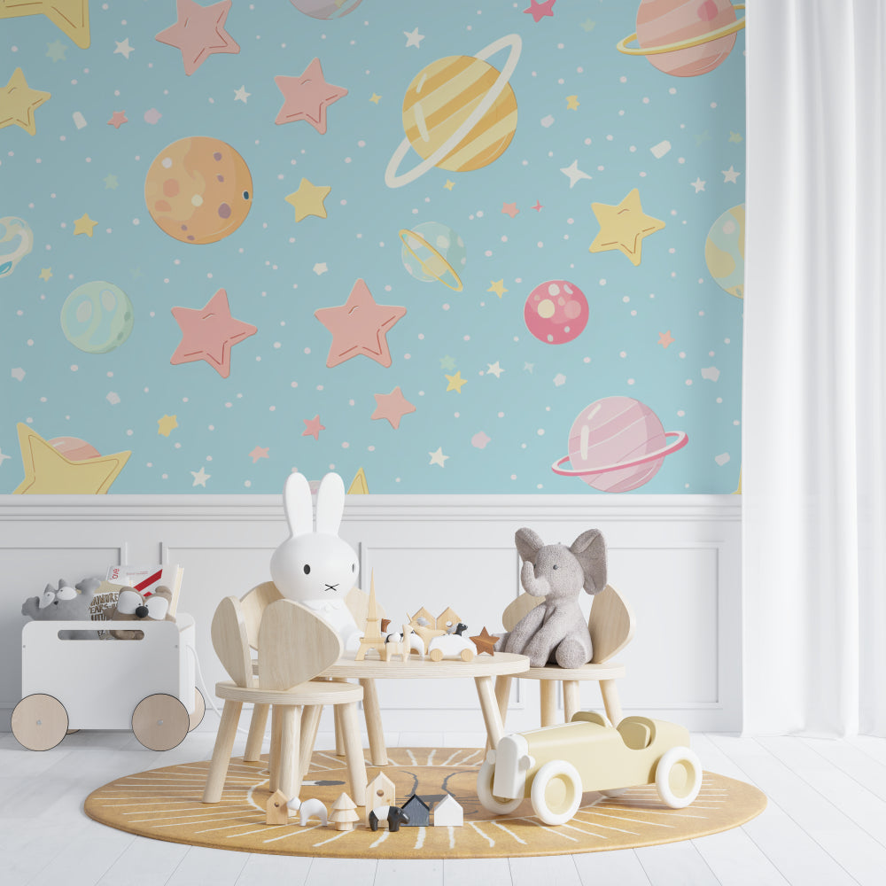 Space theme wallpaper in modern nursery with white furniture showing soft pastel planets and stars