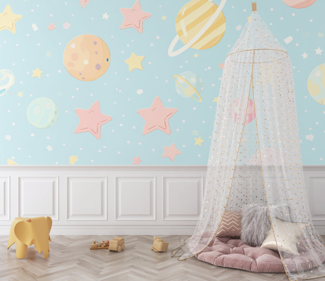 Playroom with celestial wallpaper showing scale of pastel planet design