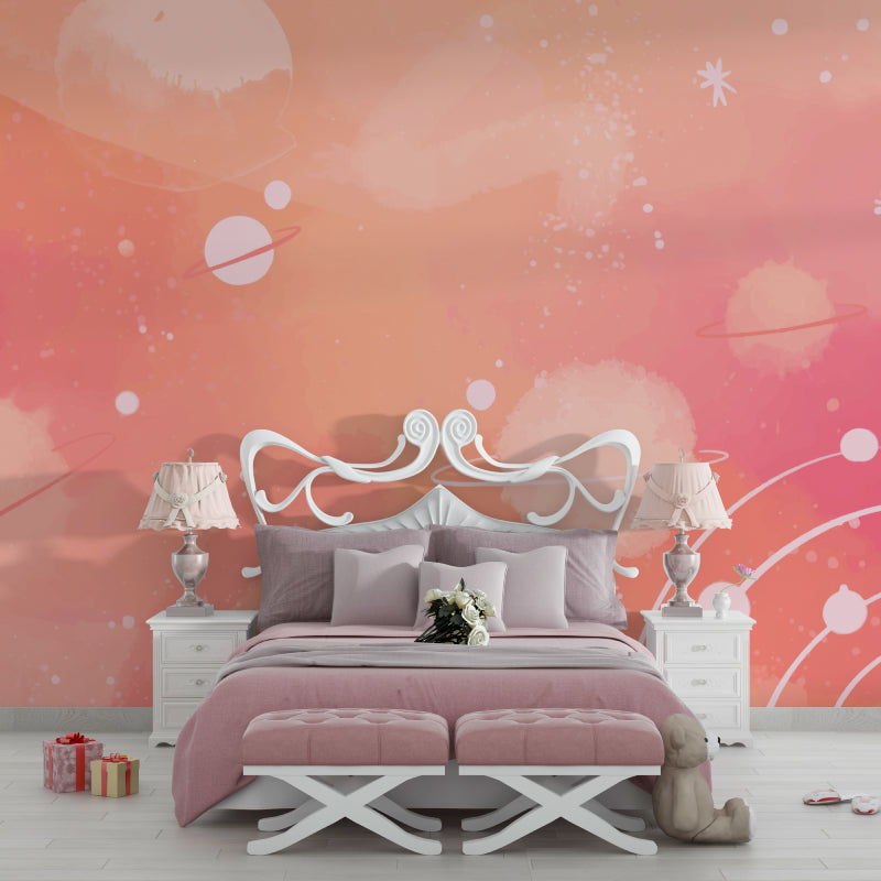 Pink Galaxy wallpaper creates dreamy atmosphere in modern nursery with white furniture